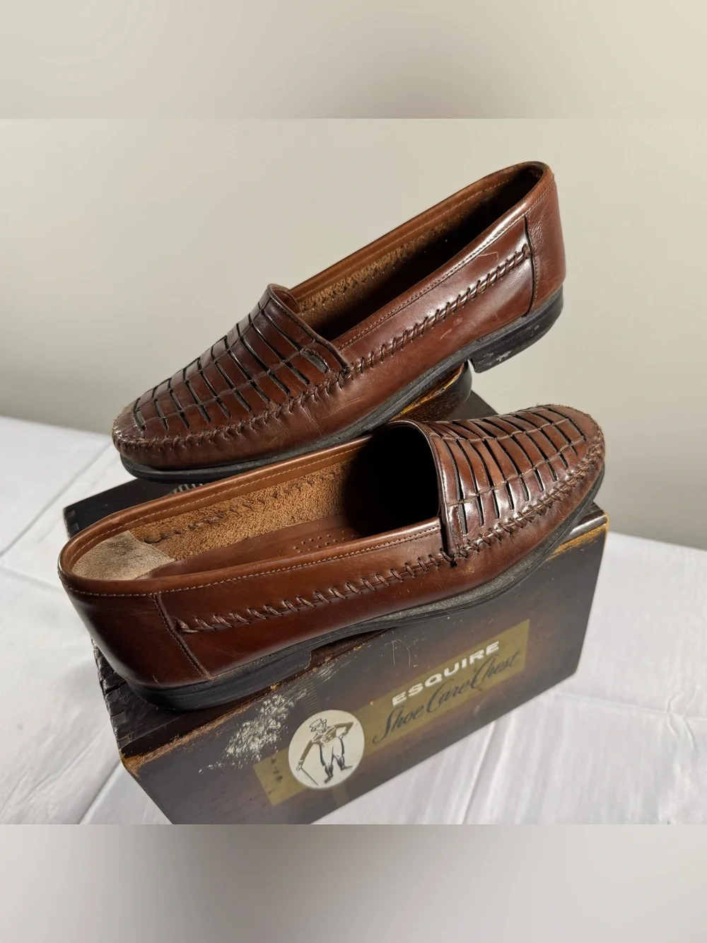 Giorgio Brutini brown leather slip-on loafers featuring a woven design